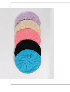 Detailed cable-knit texture of children's berets in purple, beige, pink, black and blue