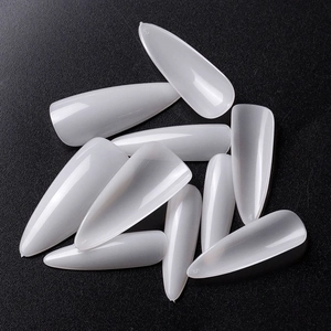 Translucent almond stiletto false nail tips with size numbers on black background