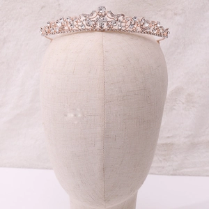 Macro detail of luxury bridal tiara with sparkling crystals on gold alloy frame