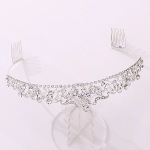 Close-up of luxury silver bridal crown with crystals and integrated hair comb teeth