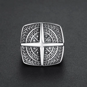 Vintage stainless steel men's ring with silver compass emblem and oxidized finish