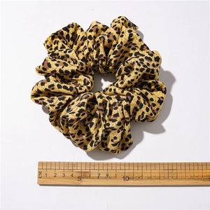 Large leopard print hair scrunchie with soft fabric showing 12cm diameter measurement