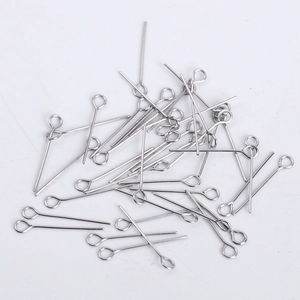 Macro shot of silver stainless steel eye pins for DIY jewelry making and bead connection
