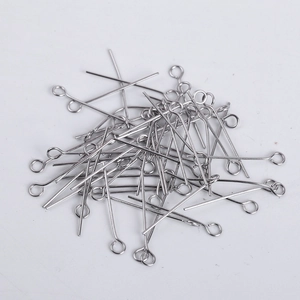 Macro shot of silver stainless steel eye pins for DIY jewelry making and beading