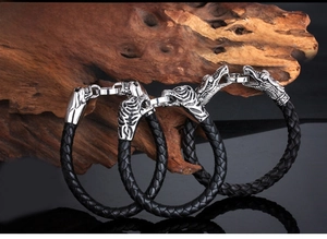 Men's retro titanium steel bracelet featuring dragon and tiger head on woven leather band
