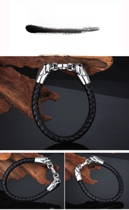 Detail of hand-woven black leather men's bracelet with silver animal head metal clasp