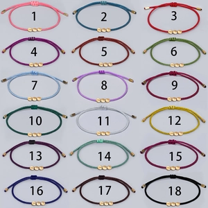 Grid display of 18 colorful woven rope bracelets with golden beads and adjustable closures