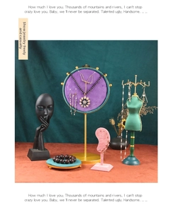 Velvet jewelry display set featuring brass necklace stands and human-shaped earring holders