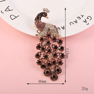 Detailed view of colorful peacock rhinestone brooch showing 113mm height and 46mm width