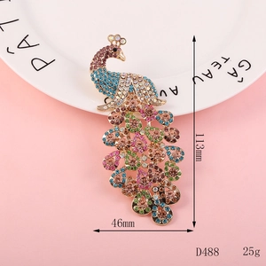 Macro detail of large peacock brooch featuring colorful rhinestones and gold plating