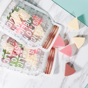 Set of triangular makeup sponges in pastel colors and stylish jar-shaped zip bags