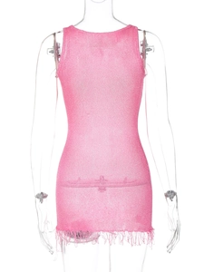 Close-up of pink knit dress back view with shimmering metallic yarn and fringe hemline