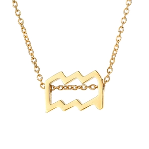 Macro shot of gold Aquarius zodiac pendant with wavy line pattern on a slim chain