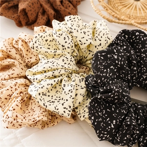Polka dot oversized fabric scrunchies set in beige, brown, black, and cream colors
