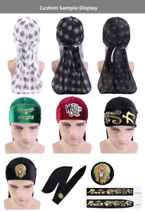 Detail of silk and velvet durags featuring custom lion embroidery and gold prints