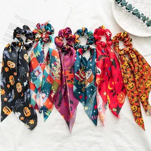 Set of seven Halloween themed satin hair scrunchies with long ribbons and festive prints