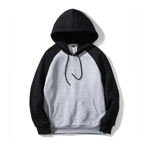 Detail of hooded sweatshirt with kangaroo pocket and ribbed cuffs in contrast colors