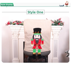 Detail of burlap Christmas chair cover featuring a Nutcracker soldier with festive embroidery