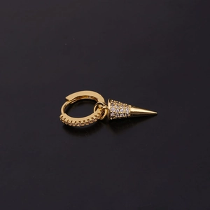 Fashionable gold snake key huggie earrings with sparkling zircon stones on black background