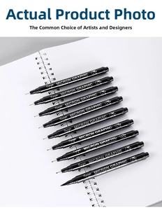 Detailed set of 10 waterproof black fine liner pens arranged on a white sketchbook