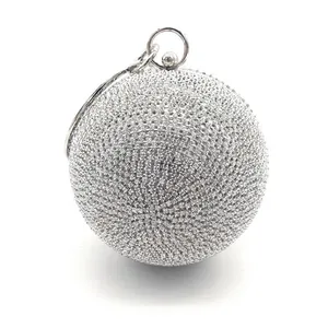 Elegant silver spherical evening clutch with sparkling rhinestones and metal ring handle