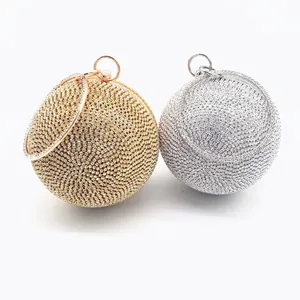 Sparkling spherical rhinestone evening clutch bag with round metal handle in gold and silver