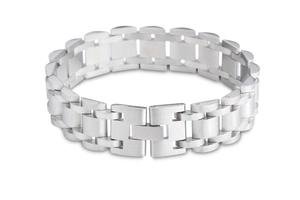 Macro detail of silver stainless steel bracelet featuring a matte brushed finish and links