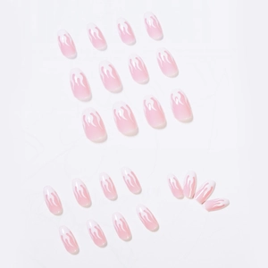 Pink and white gradient press-on nails with flame patterns in short ballet style