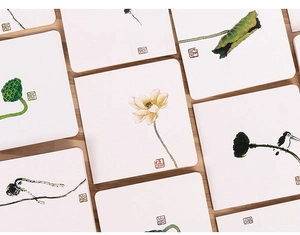 Detailed view of Chinese ink wash painting greeting cards with lotus and bird motifs