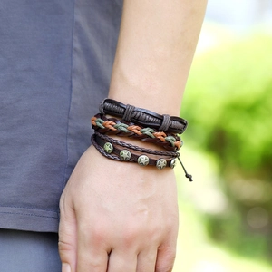 Close-up of vintage multi-layer leather bracelets with star rivets and braided textures