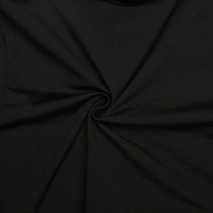 Macro shot of black elastic fabric texture and spiral pleats of the jumpsuit