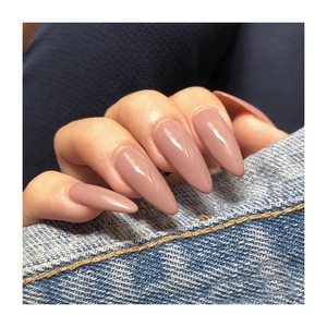 Glossy almond-shaped press-on nails in nude pink color with a high-shine finish