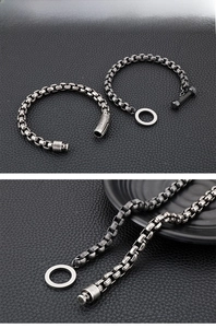 Macro-detail van industriële vintage box chain armband met OT-knevelsluiting en hardware-accenten