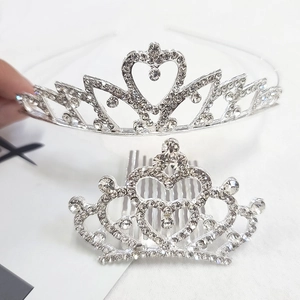 Detail of silver tiara set featuring sparkling crystal heart-shaped headband and hair comb