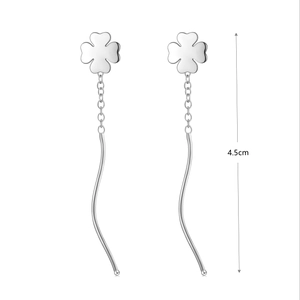 Detail view of 4.5cm S925 sterling silver tassel earrings with four-leaf clover charms