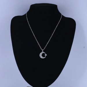 Elegant 18K silver star and moon pendant necklace with sparkling cubic zirconia