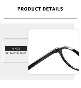 Close-up of durable metal hinge and model code YT7784 on black oval glasses frame