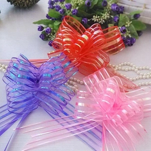 Detail of colorful organza ribbon bows with metallic stripes for gift wrapping and weddings