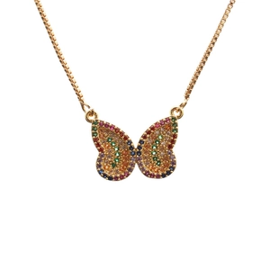 Detailed macro view of butterfly pendant with vibrant multi-colored zircon stones and gold chain