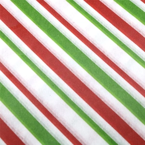 Detail of red and green diagonal stripe festive wrapping paper with smooth texture