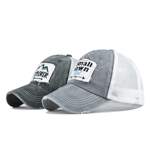 Distressed cotton trucker caps with Explorer and Small Town Girl patches and mesh back