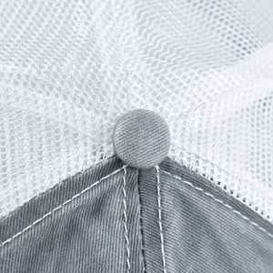 Close-up of ponytail baseball cap featuring grey cotton texture and white mesh detail