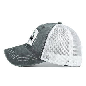 Distressed grey and white trucker hat with mountain patch and breathable mesh back