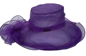 Detailed texture of dark purple organza sun hat with multilayered floral decoration