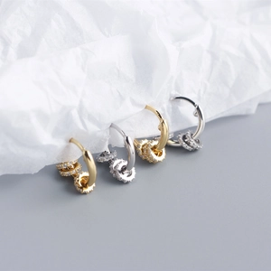 Close-up of S925 sterling silver hoop earrings with three detachable zircon charm rings