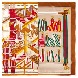 Detail of hand-rolled silk scarf featuring orange straps and brown belt patterns