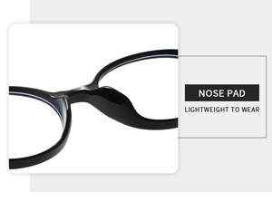 Detail of integrated nose pads on lightweight black oval plastic eyewear frame