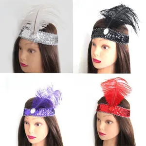 Detail of vintage Gatsby sequin headband with oval gemstone and fluffy feathers