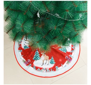 Detail of red Christmas tree skirt with reindeer, snow scene and white edge trim