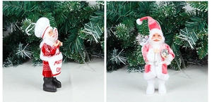 Détail de figurines Père Noël cuisinier et rose avec tablier Merry Christmas et cadeau